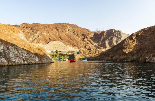 Sharjah, UAE - 08.28.2021 - Mountains surrounding Al Al Rafisah Dam in Sharjah Emirate