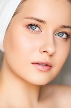 Skin care and beauty routine, beautiful woman with white towel wrapped around head, skincare cosmetics and face cosmetology, close-up portrait