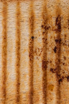 top view closeup macro detail of blank brown toasted bread slice texture background