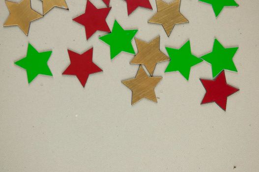 Festive backgound with many colorful small shiny stars with copy blank space.