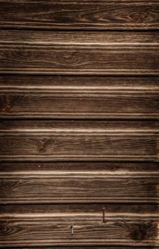 Natural brown barn wood floor / wall texture background pattern. Wood planks / boards are very old with a beautiful rustic look / style.