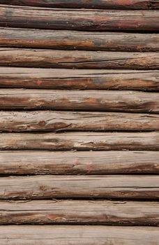 Natural wooden background - closeup of chopped firewood. Firewood stacked and prepared for winter Pile of wood logs
