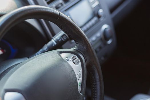 close-up photo of the steering wheel of a modern electric car