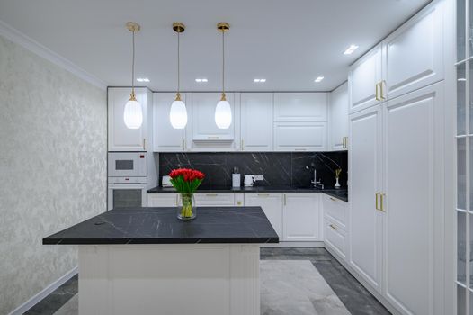 Luxury large modern domestic kitchen furniture with island and black marble worktop