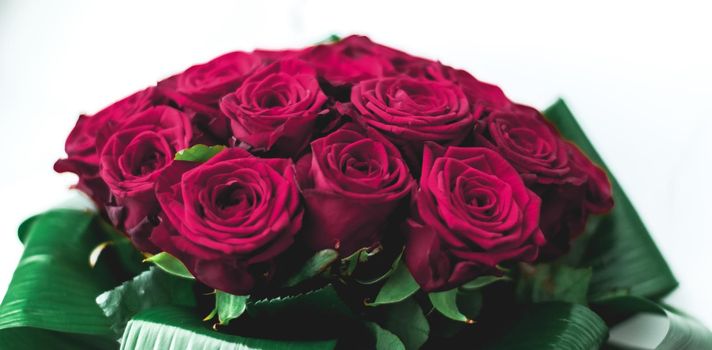 Gift for her, romantic relationship and floral design concept - Luxury bouquet of burgundy roses on marble background, beautiful flowers as holiday love present on Valentines Day