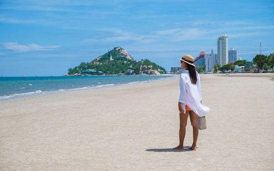 Asian women walking on the beach in the morning at Takiab Beach Huahin Thailand