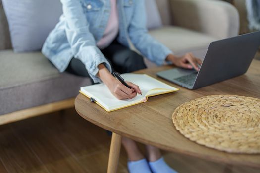 Portrait of African Americans using notebooks, pens to take notes and computers. to study through the Internet, online e learning concept