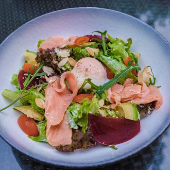 salmon salad with red beet and vegetables.