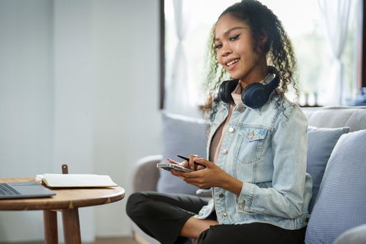 Portrait of African Americans using smartphone mobile and computers. to study through the Internet, online e learning concept