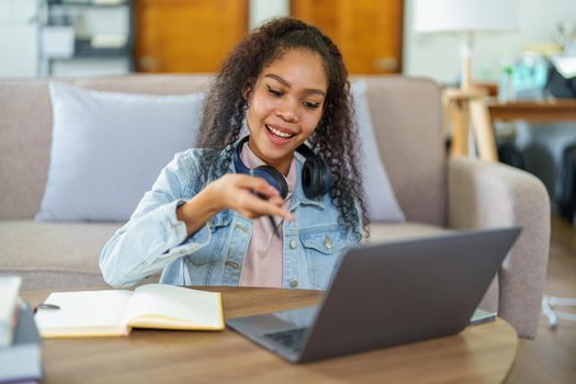 Portrait of African Americans using notebooks, pens to take notes and computers. to study through the Internet, online e learning concept