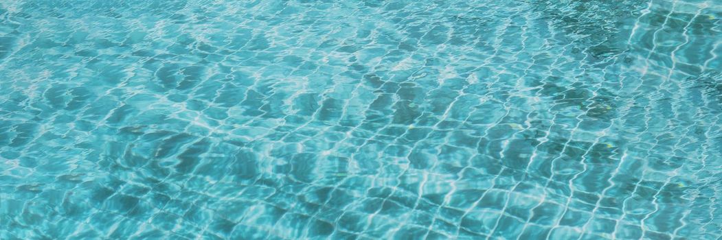 Abstract background Patterns Ripped water Surface swimming pool Light Reflection Vibrant blue green.