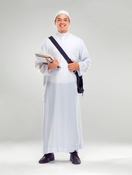 Education is essential. Studio portrait of a young arabic man carrying books