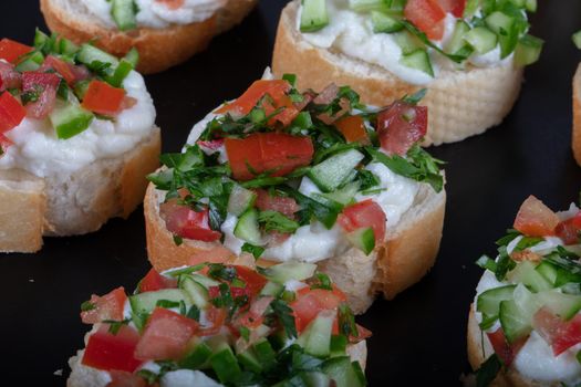 Bruschetta with tomatoes, mozzarella cheese and basil on a old rustic table. Traditional italian appetizer or snack, antipasto. High quality photo