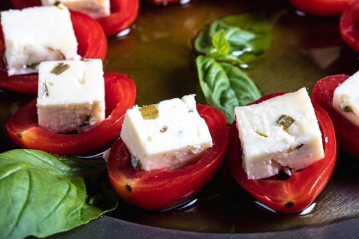 Stuffed tomatoes with cheese and basil . High quality photo