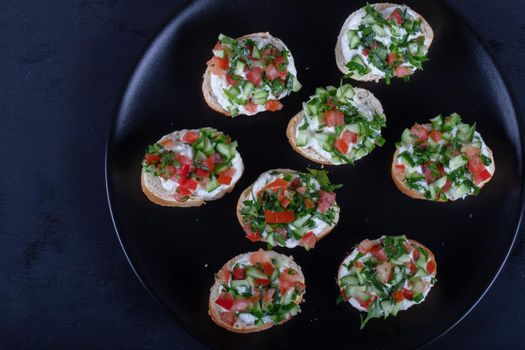 Bruschetta with tomatoes, mozzarella cheese and basil on a old rustic table. Traditional italian appetizer or snack, antipasto. High quality photo