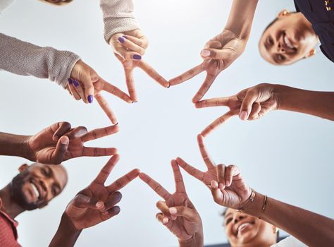 Friends doing a star with hands, with synergy as a team at a team building event and being outdoors in the sun. Business success means productive staff, showing unity and using collaboration.