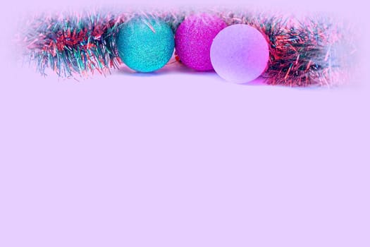 Holiday card for text on a white background with decor elements. Christmas balls, Christmas balls, Christmas tree rain covered with snow. Pink space for text