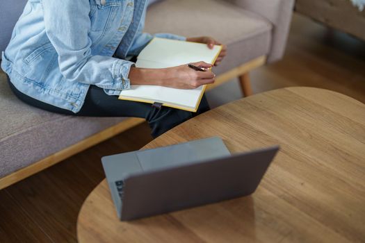 Portrait of African Americans using notebooks, pens to take notes and computers. to study through the Internet, online e learning concept