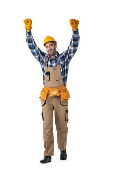 Full length of happy young manual worker with hands raised isolated over white background