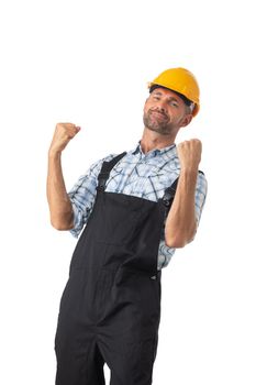 Portrait of happy confident male repairman contractor worker in coveralls and yellow hardhat isolated on white background