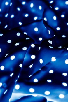 Fashion design, interior decor and vintage material concept - Classic polka dot textile background texture, white dots on blue luxury fabric design pattern