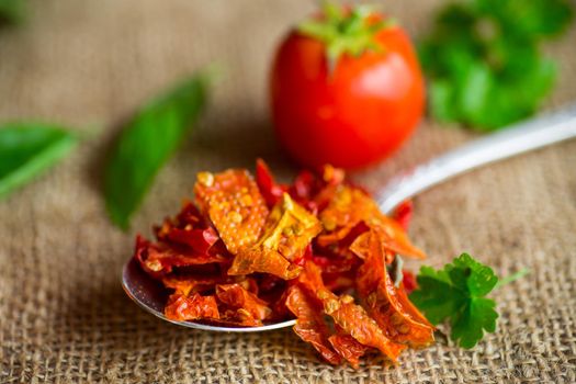 small pieces of dried tomatoes next to fresh tomatoes, natural homemade spices