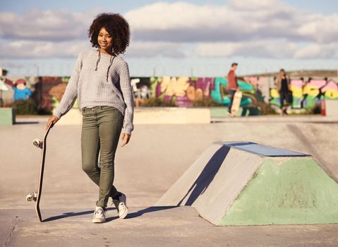 Why walk when you can skate. a young woman out skateboarding in the city