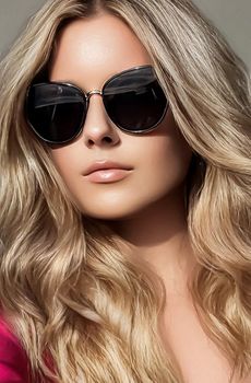 Luxury fashion, blonde hairstyle and accessories, beauty face portrait of a woman with long blond hair, wearing chic sunglasses, glamour style close-up