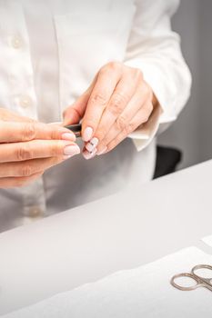 Professional manicurist preparing tools for doing clients nails