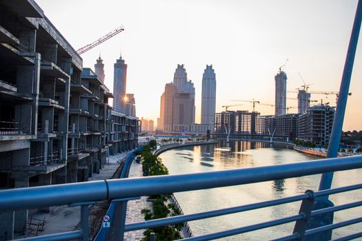 Partial view of Dubai city landscape from the bridge known as a tolerance bridge. Early morning. Outdoors