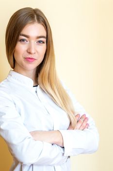 Closeup portrait of a female healthcare professional, dentist, doctor, nurse, the assistant on light yellow background