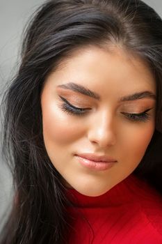 Portrait of young beautiful woman with long lashes and closed eyes after eyelash extensions