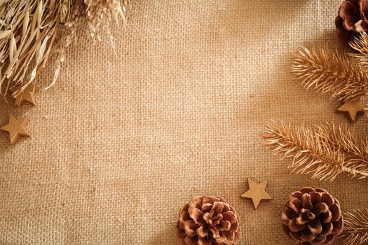 Christmas composition with natural colors and materials. Xmas background. Decoration elements, pine cones. Free space for text, copy space. Flat lay, top view