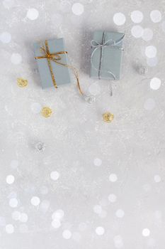 Christmas gift boxes on the grey festive background, top view, copy space