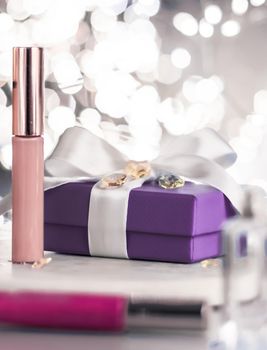 Cosmetic branding, Christmas glitter and girly blog concept - Holiday make-up foundation base, concealer and purple gift box, luxury cosmetics present and blank label products for beauty brand design