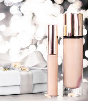 Cosmetic branding, Christmas glitter and girly blog concept - Holiday make-up foundation base, concealer and white gift box, luxury cosmetics present and blank label products for beauty brand design