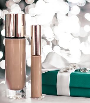 Cosmetic branding, Christmas glitter and girly blog concept - Holiday make-up foundation base, concealer and green gift box, luxury cosmetics present and blank label products for beauty brand design