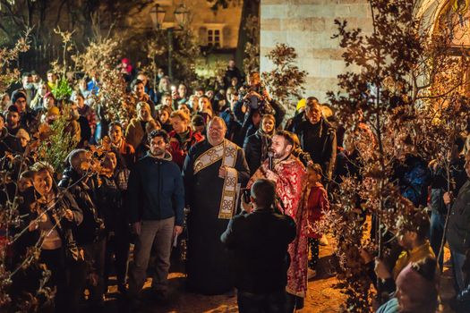 Montenegro, Budva 7.01. 2021: Christian Christmas in Montenegro, the feast of the oak branch. People burn an oak branch in honor of Christmas.