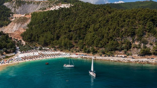 Top daytime aerial view of famous Marble beach at Thassos island, Greece