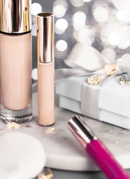 Cosmetic branding, Christmas glitter and girly blog concept - Holiday make-up foundation base, concealer and white gift box, luxury cosmetics present and blank label products for beauty brand design