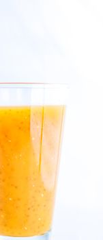 Healthy nutrition, organic drink and fasting cleanse concept - Glass of orange fruit smoothie juice with chia seeds for diet detox, perfect breakfast recipe