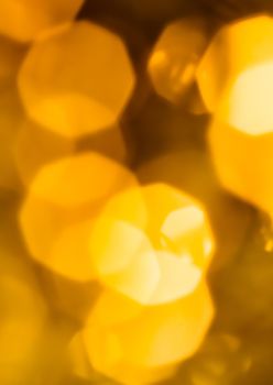 Golden Christmas lights, New Years Eve fireworks and abstract texture concept - Glamorous gold shiny glow and glitter, luxury holiday background