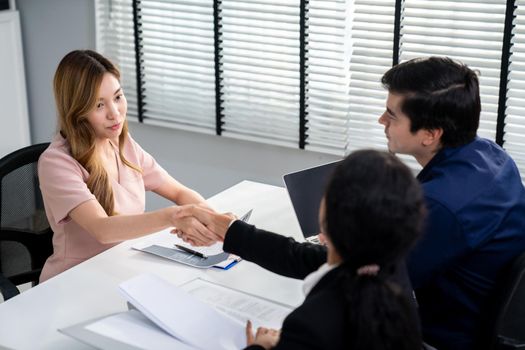 A new and competent female employee successfully interviewed. Newly graduated gets her first job after the interview.