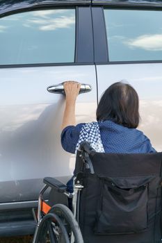 Elderly woman open door car