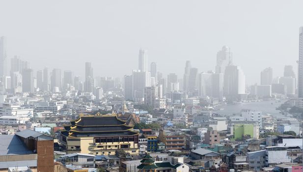 Downtown skyscrapers of the city of Bankok. Poor visibility, smog, caused by dust and smoke high level PM2.5  air pollution.