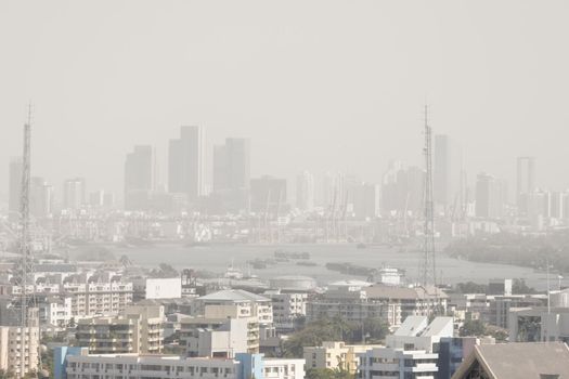 Downtown skyscrapers of the city of Bankok. Poor visibility, smog, caused by dust and smoke high level PM2.5  air pollution.