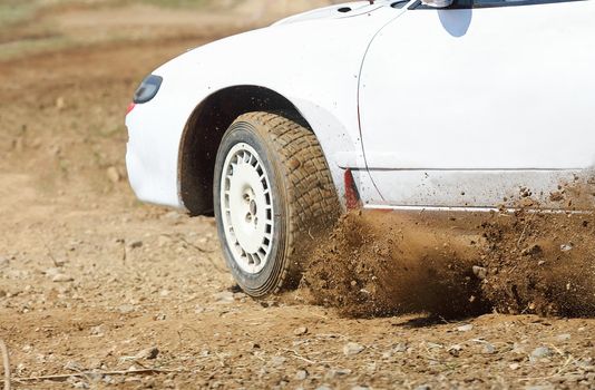 Rally car turning in track