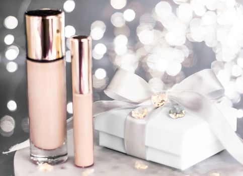 Cosmetic branding, Christmas glitter and girly blog concept - Holiday make-up foundation base, concealer and white gift box, luxury cosmetics present and blank label products for beauty brand design