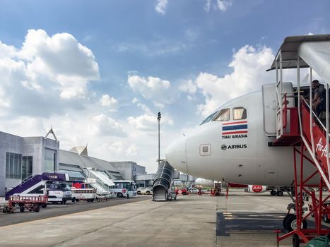 Passengers is getting on a Thai Air Asia plane at Krabi International Airport on Feb 14,2017 in Krabi, Thailand.