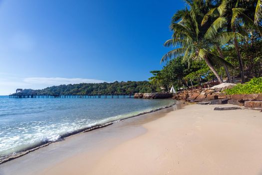 Beautiful tropical beach , wooden pier and tropical palm trees, summer holidays in Thailand, Koh Kood